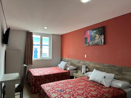 Ένα ή περισσότερα κρεβάτια σε δωμάτιο στο Hotel Teresita