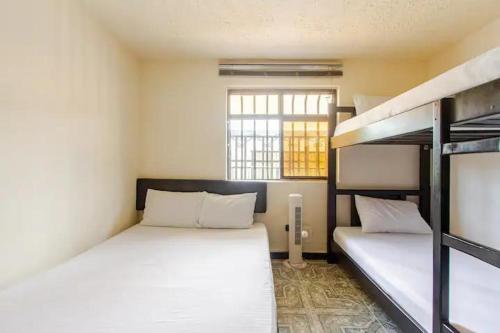 Ένα ή περισσότερα κρεβάτια σε δωμάτιο στο Casa Quindio