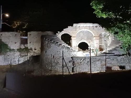 an old building with a bunch of stairs at night at La Casa Del Borgo Cavallaro in Gaggi