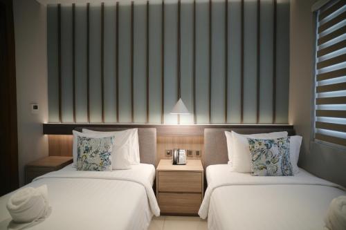 Ένα ή περισσότερα κρεβάτια σε δωμάτιο στο The Hotel Andrea