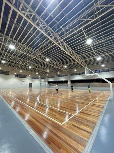 a court with people playing a game of volleyball at 1 BR Condo with balcony in Verdon Parc with Sea View in Sanghay
