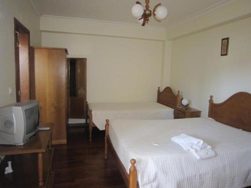 Ένα ή περισσότερα κρεβάτια σε δωμάτιο στο Residencial Mira-Sol