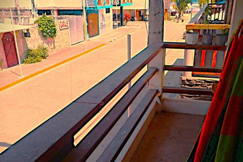 a bench in a train station with a platform at Casa yagual in Olón