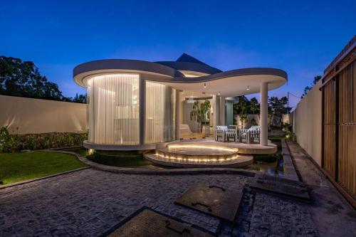 a large house with a circular roof at Uniquely designed 1bd villa with Pvt Pool in Umalas