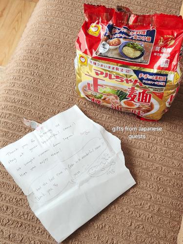 a package of food sitting next to a bag of food at The Traveller's Haven Airbnb in Cebu City
