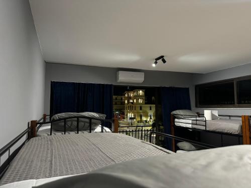 a bedroom with two bunk beds and a room with at BLUE LINE Coliving in Piraeus