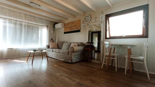 a living room with a couch and a table at Domček na samote in Nové Mesto nad Váhom