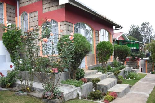 a house with a garden in front of it at 3-bedroom serenity homes in Langata Rongai