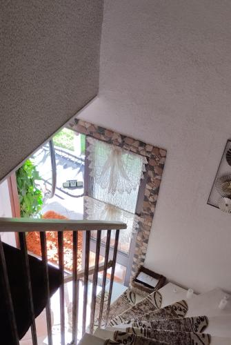 a room with a staircase with a stone fireplace at ruhiger als im Hotel, keine andere Gäste in Merkendorf