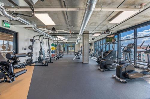 a gym with treadmills and cardio equipment in a building at Exceptional 1BD BA-PoolHotTubGymParking- Downtown! in Salt Lake City