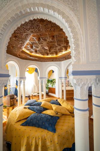 a bedroom with a bed with a coffered ceiling at Villa de Gor in Gor