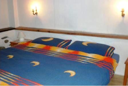 Кровать или кровати в номере Rustico Il Nido