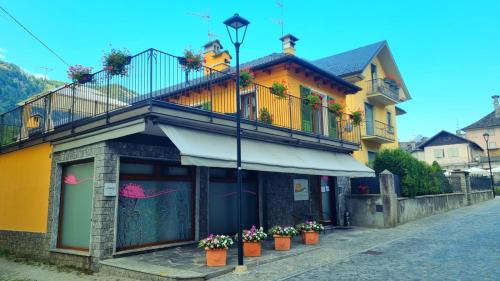 a building with a balcony on the side of a street at La Terrazza in Malesco