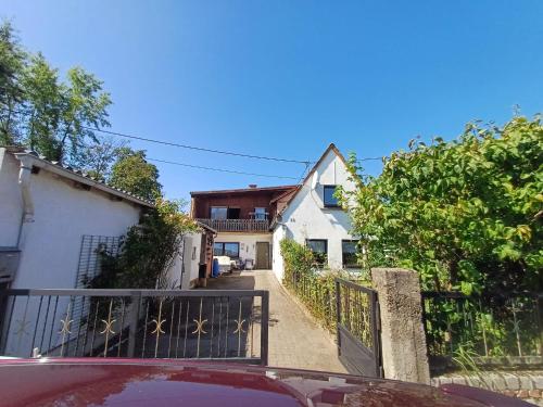 a car parked in front of a house with a gate at Haus Asparagus in Hanhofen
