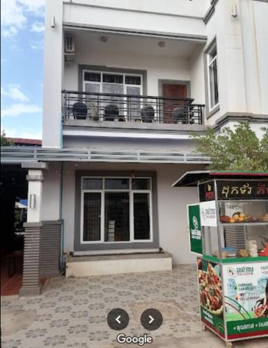 a white house with a food box in front of it at Kalinga Art Home Guest House in Siem Reap