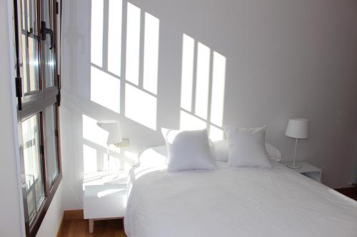 Cama o camas de una habitación en Apartaments Plaza Príncipe Viana