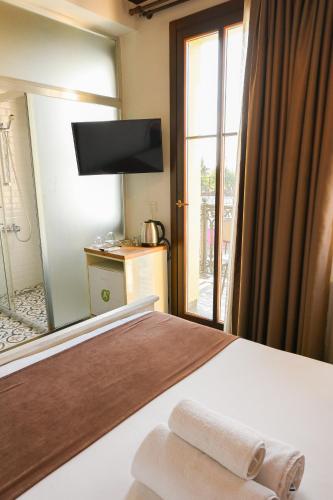 Postel nebo postele na pokoji v ubytování Galata Dream Hotel