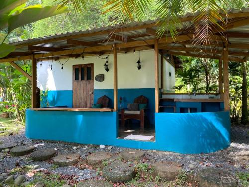 a house with a blue and white exterior at Rancho Burica in Pavones