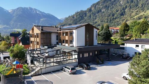 an aerial view of a building with a parking lot at Hotel Hubertus in Sankt Johann im Pongau