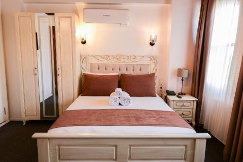 Postel nebo postele na pokoji v ubytování Galata Dream Hotel