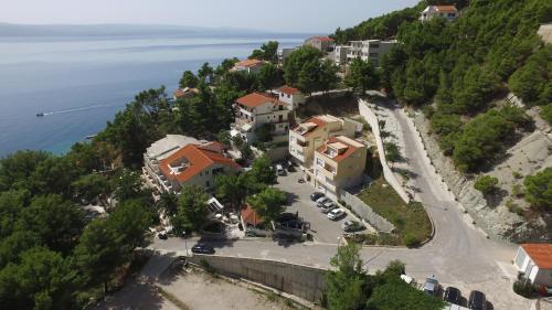 an aerial view of a town on a hill near the water at Apartments Villa Astra & Pinija in Brela