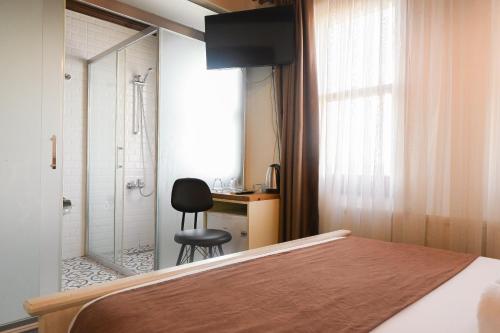 Postel nebo postele na pokoji v ubytování Galata Dream Hotel