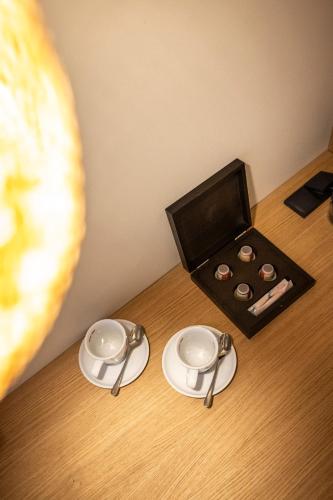 a table with two plates and a box of chocolates at Hotel Hubertus in Sankt Johann im Pongau