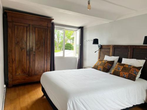 Postel nebo postele na pokoji v ubytování Maison normande, mer et campagne - gîte Cyrano