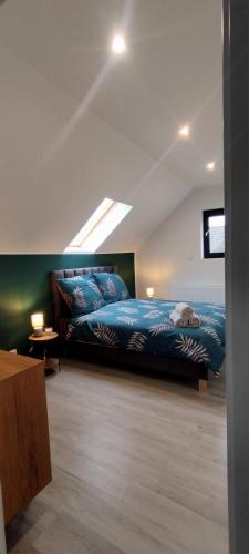 a bedroom with a bed with a cat laying on it at Stodoła in Brenna