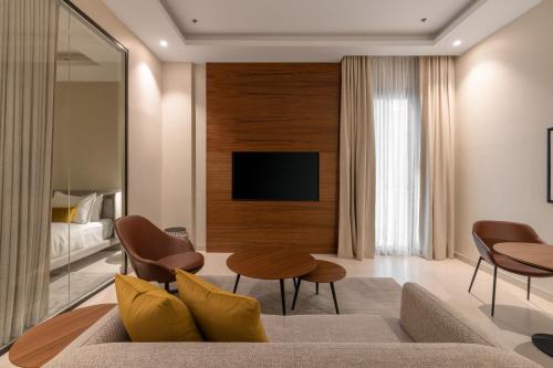 a living room with a couch and a tv at Rafa- Hittin in Riyadh