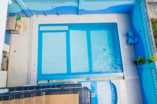 an overhead view of a large swimming pool at Pidows studio apartment in Shanzu
