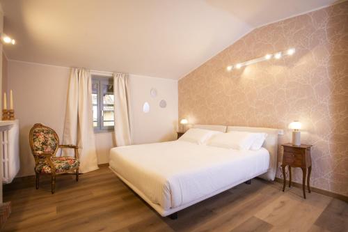 Postel nebo postele na pokoji v ubytování Palazzo Ratti Boutique Rooms