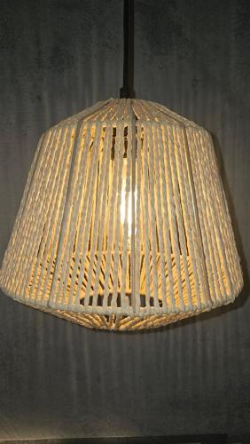 a large white pendant light hanging from a ceiling at Atlantis Boutique City Hotel in Rhodes Town