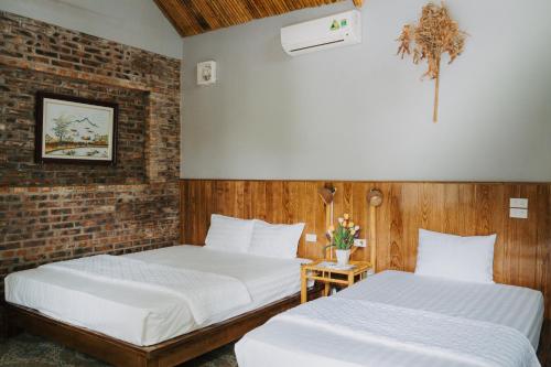 Postel nebo postele na pokoji v ubytování Tam Coc Lakeside Homestay