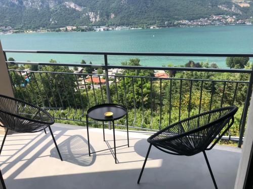 a balcony with two chairs and a view of the water at Casitamia b&b in Clusane sul Lago