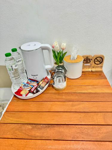 a counter with a coffee maker and other items on it at สบายดีห้องเช่า รายวัน รายเดือน in Sa Kaeo