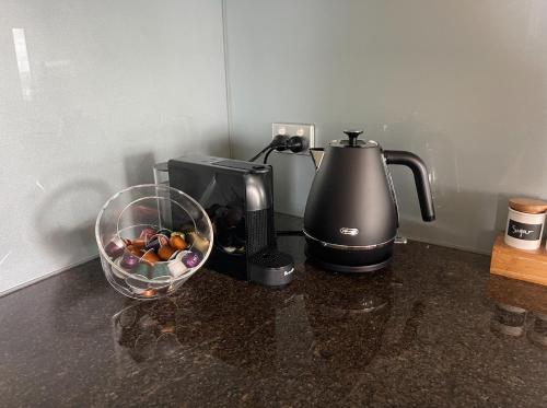 a coffee maker and a mixer on a counter at Spacious 3 Bedroom Apartment Southbank in Melbourne