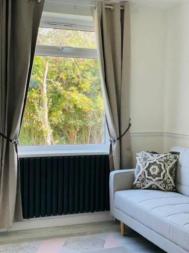 a living room with a radiator and a window at Luxe Residences - Preston in Preston