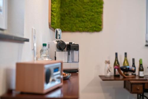 a microwave sitting on a counter in a kitchen at Apartment Burgunderliebe am Tuniberg, Weinregion in Gottenheim