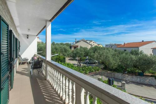 a balcony with a view of a park at Apartment Damir in Brodarica