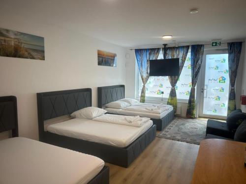 Postel nebo postele na pokoji v ubytování Ferienwohnung im Hamburger Straße-4