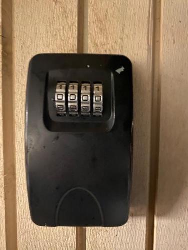 a black remote control hanging on a wall at New and modern entire rental unit in Ås/Ski Norway in Ås