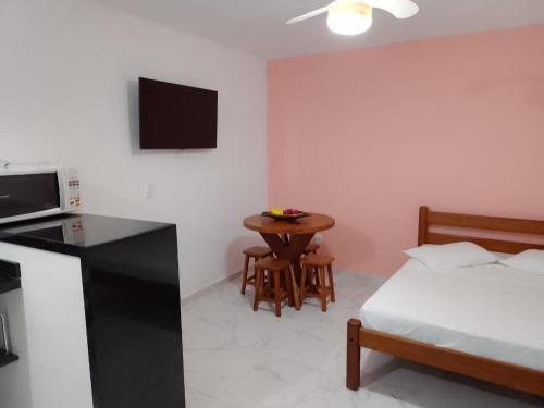 Ένα ή περισσότερα κρεβάτια σε δωμάτιο στο Em Harmonia com a Natureza