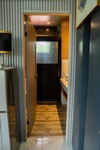 a hallway with a door leading to a kitchen at Gensan Apartment in Dulongabong
