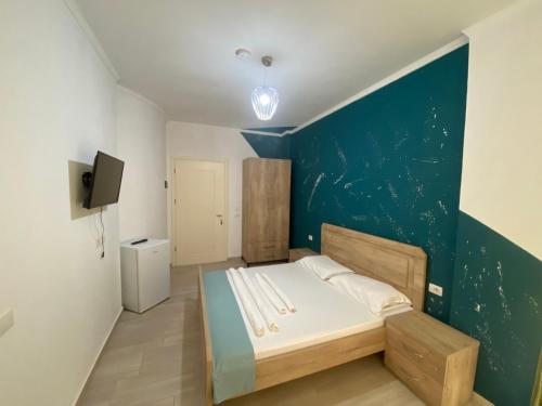 Ένα ή περισσότερα κρεβάτια σε δωμάτιο στο Villa Luan Ksamil
