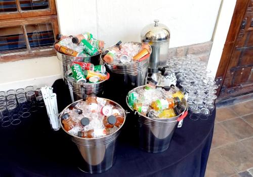 a bunch of buckets filled with candy on a table at Midrand Conference Centre in Midrand