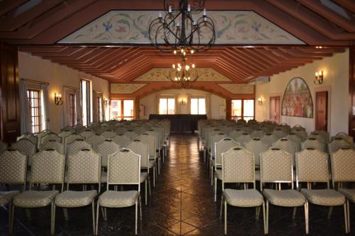 a room with rows of chairs and a chandelier at Midrand Conference Centre in Midrand