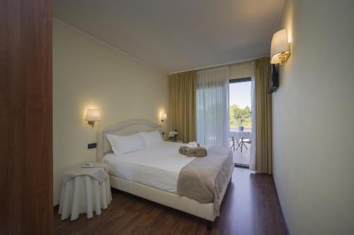 Ένα ή περισσότερα κρεβάτια σε δωμάτιο στο Admiral Hotel Villa Erme
