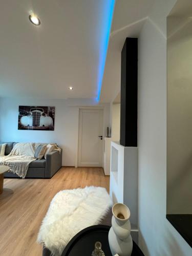 a living room with a bed and a couch at luxury Apartment by Skyactive in Tromsø