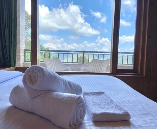 The Rustic villa kasauliにあるベッド